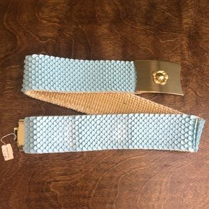 Vintage women’s elastic belt with gold toned belt buckle and original tags